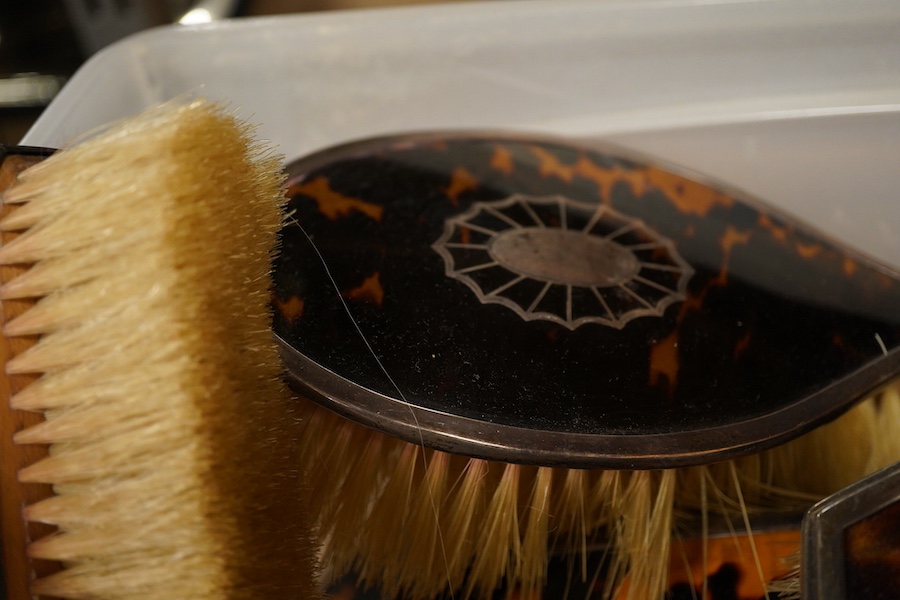 Two George V silver mounted tortoiseshell five piece dressing table sets, first Birmingham, 1925, Levi & Salaman, inlaid with fan paterae second in Art Deco style London, 1931, Collett & Anderson, (10)